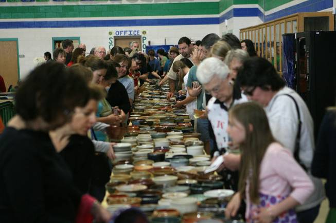 People browse at ceremic bowls during the Empty Bowl benefit luncheon at Green Valley High Saturday, March 21, 2009. Money raised during the event will be used to feed the homeless of Las Vegas. 