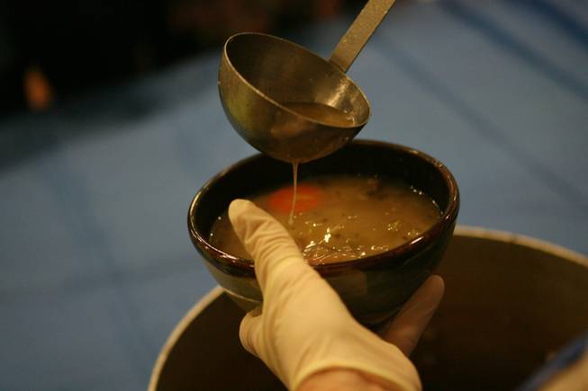 A volunteer serves up soup during the Empty Bowl benefit luncheon at Green Valley High Saturday, March 21, 2009. Money raised during the event will be used to feed the homeless of Las Vegas.
