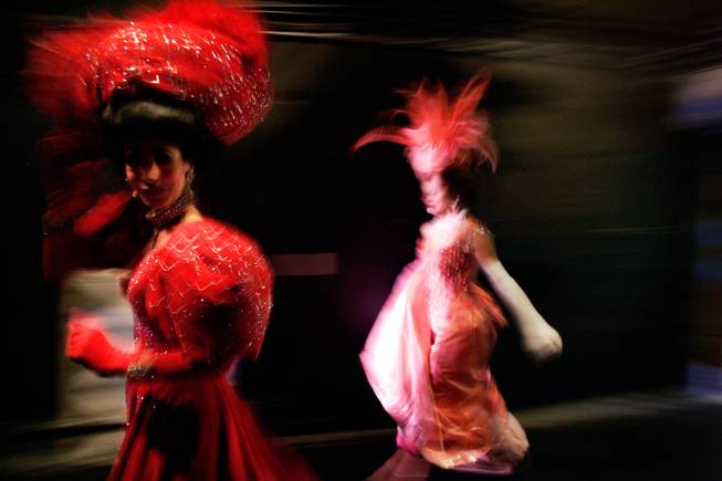 Showgirl Janu Tornell, left, rushes onstage for the final number ...