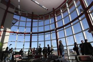 Guests tour the 30,000-square-foot Papillon Airways Boulder City passenger terminal Monday during the grand-opening ceremony.