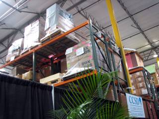 Warehouse shelves are stacked high with donated goods at the Teachers Exchange, which operates out of space donated by Czarnowski Exhibit Services. A grant from the Harrah's Foundation is being used to expand its reach.