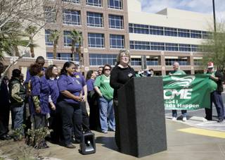 AFSCME member Jeanine Lake addresses employed and unemployed workers as they gather Monday in front of the Grant Sawyer Building in protest of the recent pay increases Gov. Jim Gibbons gave to some of his staff. 