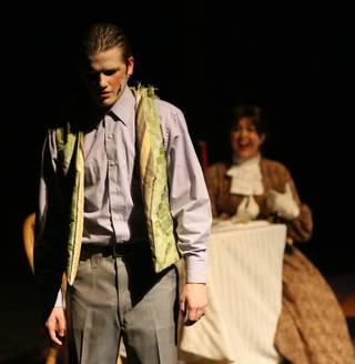 Theater students Tyler Fitzgerald, foreground, and Chloe Weise, from The Meadows School, perform on stage during a dress rehearsal of the musical 