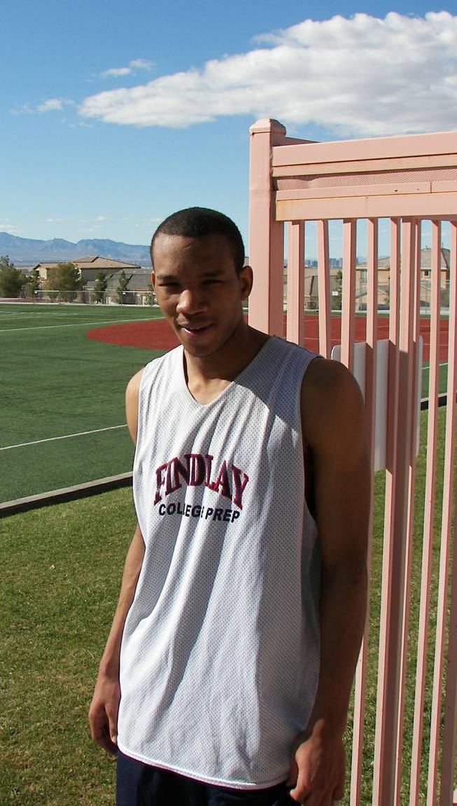 Findlay College Prep senior shooting guard Avery Bradley, who will play at Texas next fall, stands outside the Henderson International School gym after Monday's practice.