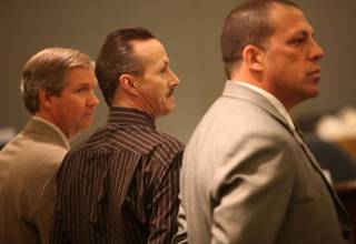 Stephen N. Murray (center) stands with Public Defenders Darin Imlay (left) and Stephen Immerman as the jury enters the courtroom Wednesday, the first day of Murray's trial. 