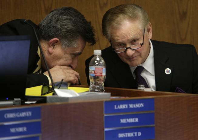 Clark County Schools Superintendent Walt Rulffes, right, listens to board member Larry Mason on Thursday after Rulffes announced he will retire. Rulffes plans to leave in August when his contract expires.