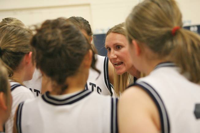 Coach Kate Elles talks to the Garrett girls basketball team.