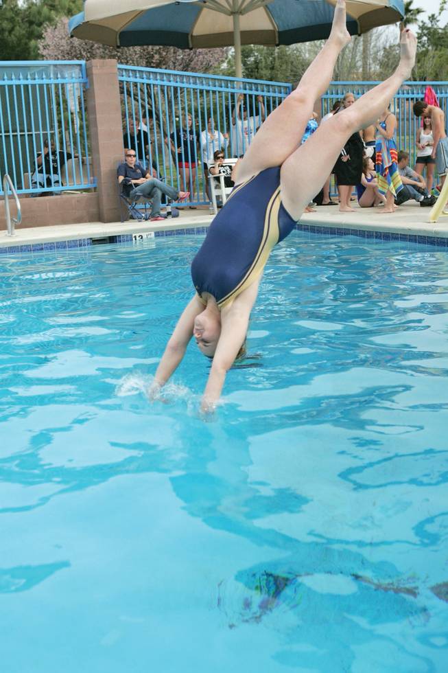 Jenna Rassochine hits the water at the Silver Springs Pool.