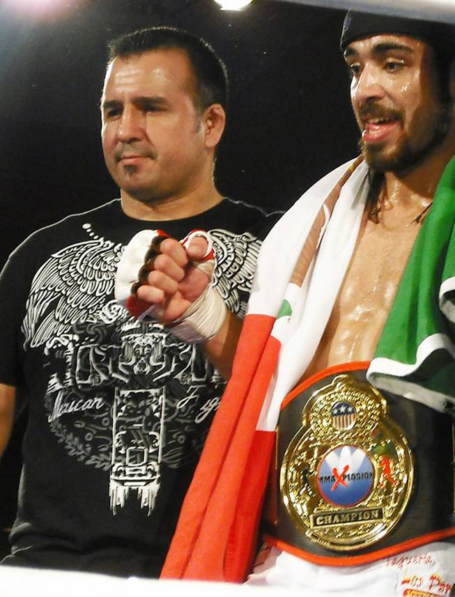 Javier Torres, right, celebrates his second-round victory over Josh McBride at MMA Xplosion inside Planet Hollywood on March 20, 2009.

