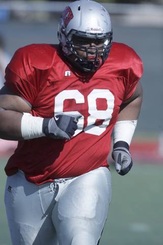 Defensive lineman Nate Holloway is shown during the first scrimmage of the season at Rebel Field on UNLV campus Friday, March 26, 2010.