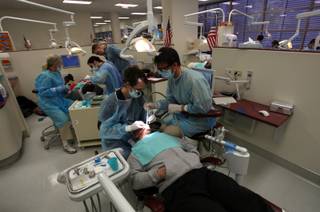The UNLV Dental School of Medicine faculty and students put on three clinics Saturday to treat local children, veterans, and women referred by Shade Tree Shelter. The clinics are designed for people who do not qualify for Medicaid or are uninsured. The event also provides UNLV dental residents with clinical experience.

