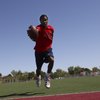 Valley High's Garic Wharton broke the 200-meter dash 4A state record with a time of 21.1 seconds at 