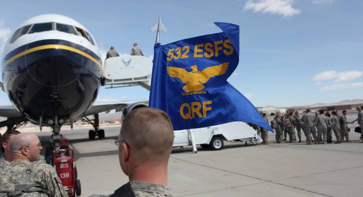 Members of the more than 130 Airmen assigned to the 99th Air Base Wing Security Forces Group gather after arriving at Nellis Air Force Base on Wednesday, returning from an eight-month deployment and combat duty in Iraq.