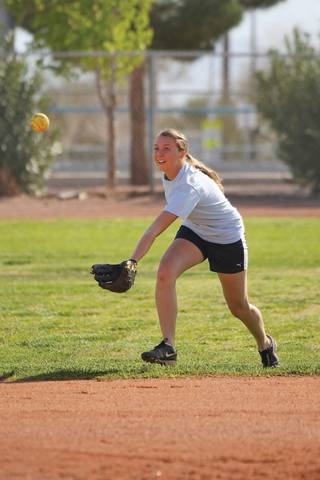 Boulder City's center fielder Brittany Patt leans in to make a catch Wednesday during outfielder practice at Boulder City High School.
