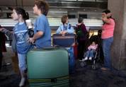 McDoniel fifth graders wait at McCarran Airport Friday as they head out to Costa Rica for spring break as a finale to their six years of Spanish immersion education.

