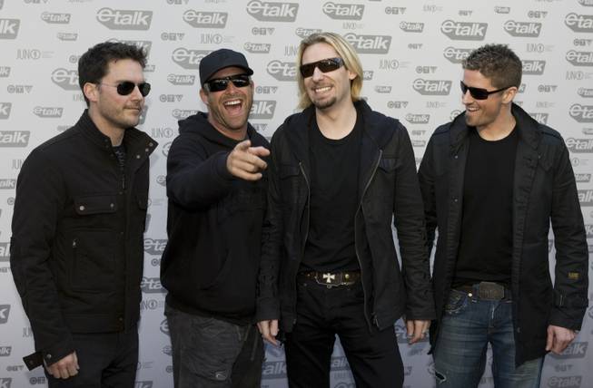 Members of the band Nickelback arrive on the red carpet for the JUNO Awards in Vancouver, Sunday, March 29, 2009. 