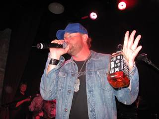 Toby Keith performs with a bottle of JD at Toby Keith's I Love This Bar and Grill on April 4. 