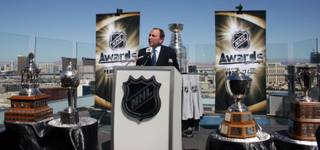 NHL commissioner Gary Bettman speaks to local media among some of hockey's most cherished hardware outside the Ghostbar at the Palms on Apr. 6.