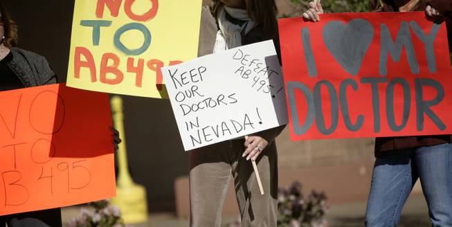 Health advocates rally in opposition of Assembly Bill 495 in front of the Grant Sawyer State Office building in Las Vegas Monday morning.


