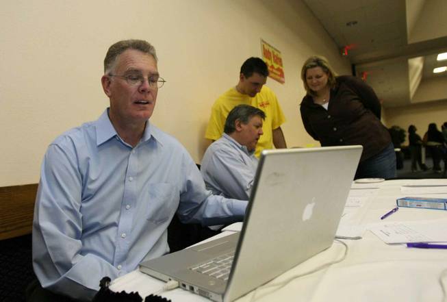 Henderson mayoral candidate Andy Hafen checks the race results Tuesday during his campaign's party at the Henderson Convention Center.