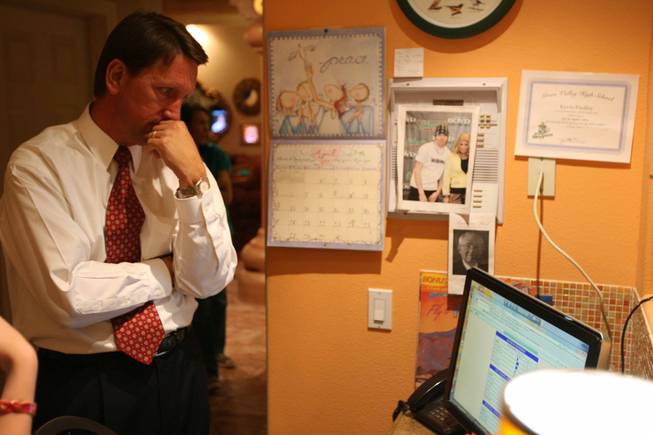 Henderson mayoral candidate Steve Kirk keeps tabs on election results on a computer during his campaign's party Tuesday. 