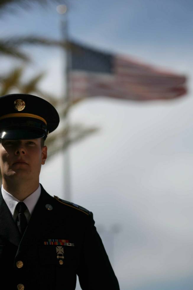 Spc. Matthew Andenoro, of the National Guard's firing party, stands guard during a memorial ceremony for Staff Sgt. Matthew Sneck at the Nevada Army Guard's Clark County Armory.