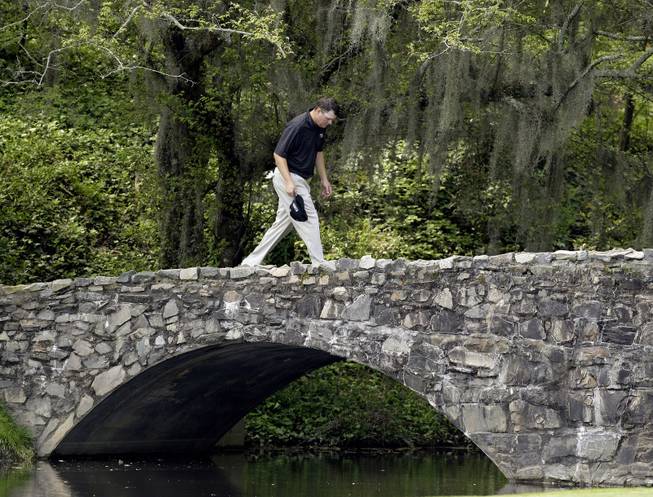 Former UNLV golfer Chad Campbell crosses the Nelson Bridge to the 13th fairway during the second round of the Masters golf tournament. Campbell remained atop the leader board, tied with Kenny Perry at 135.