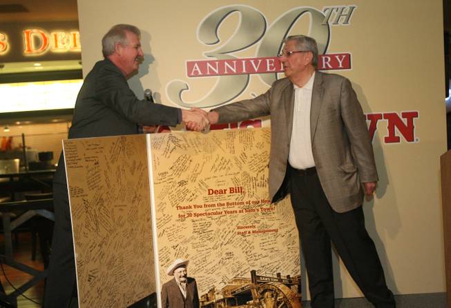 Mike Garms, left, vice president and general manager of Sam's Town, presents Bill Boyd with a greeting card signed by staff and management during a ceremony celebrating the 30th anniversary of the hotel April 11, 2009.
