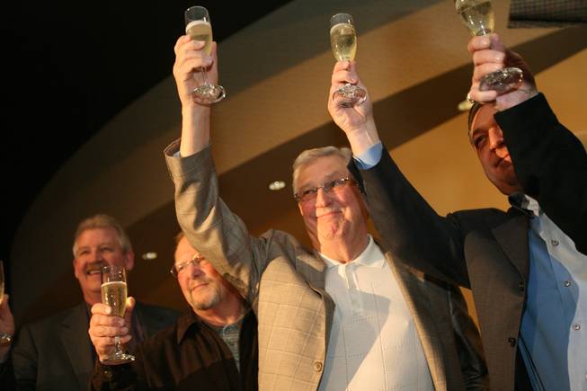 Bill Boyd, executive chairman of Sam's Town, center, shares a toast with, from left, Mike Garms, vice president and general manager; Bob Newman, former general manager; and Keith Smith, president and CEO, during a ceremony celebrating the hotel's 30th anniversary.