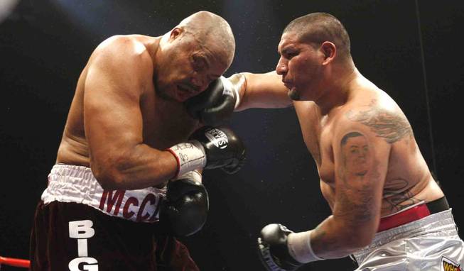 Chris Arreola (right) connects on Jameel McCline, both of the U.S., during a heavyweight fight at the Mandalay Bay Events Center in Las Vegas, Nevada, April 11, 2009.