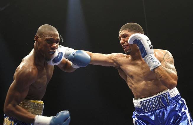 Winky Wright (right) punches at Paul Williams, during a middleweight fight at the Mandalay Bay Events Center April 11, 2009.