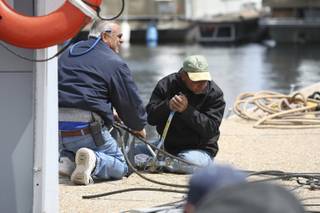 Las Vegas Boat Harbor owner John Kaiser, left, and Johnny Koeller repair dock cables Wednesday after strong wind gusts hit the Las Vegas Boat Harbor at Lake Mead National Recreation Area on Tuesday night.