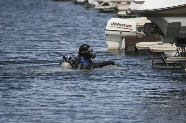Scuba diver John Weston surveys the underwater damage to docks Wednesday after strong wind gusts hit the Las Vegas Boat Harbor at Lake Mead National Recreation Area on Tuesday night.