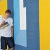 Boulder City High junior Matt Lundgren, the holder of the 3A state titles in the 1600 and 3200 meter events, poses with his record setting shoes.
