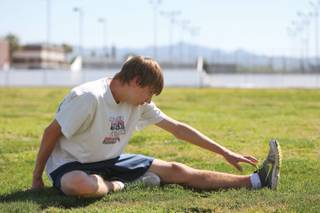 Boulder City junior Matt Lundgren warms up during spring break cross-country practice.