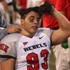 Malo Taumua gets wrapped up Friday night as UNLV plays its annual spring game at Sam Boyd Stadium.