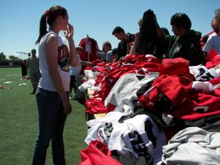 The shirts and jerseys are piled high, but they went fast Saturday morning as UNLV fans and students, and others looking for great deals, grabbed items by the handful at Rebel Park.