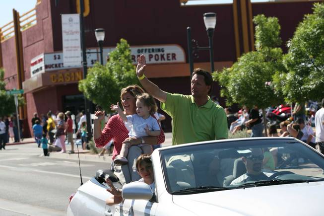 Henderson Mayoral candidate Steve Kirk, right, with his wife, Amy, and granddaughter Annie ride in a vehicle during the Heritage Parade on Water Street.