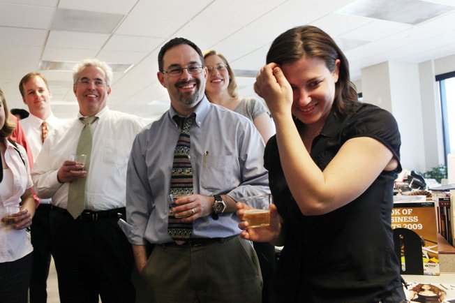 Editorial writers, David Clayton, from left, and Matt Hufman, share in remarks and champagne with reporter Alexandra Berzon on Monday in celebration of the Las Vegas Sun winning the Pulitzer Prize for public service for exposing a high death rate among construction workers on the Las Vegas Strip, at the Las Vegas Sun offices.