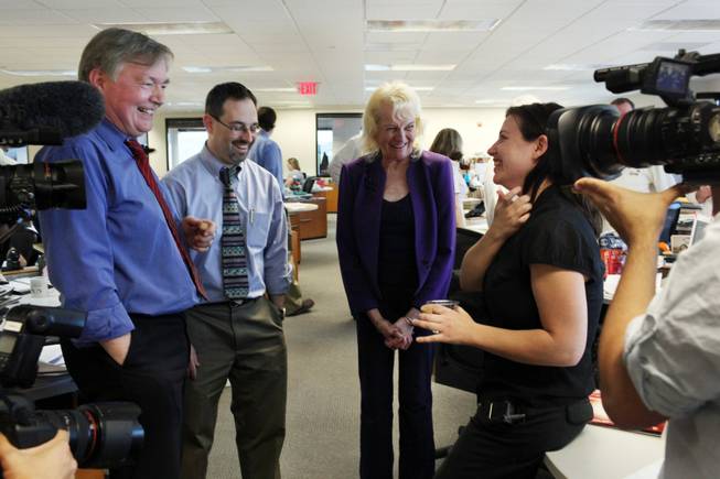 Deputy managing editor Drex Heikes, from left, editorial writer Matt Hufman, and reporters Mary Manning and Alexandra Berzon chat during a gathering to celebrate the Las Vegas Sun's win of the Pulitzer Prize for public service on Monday. 