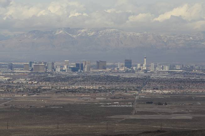 This photograph from December 2008 shows a view of the Las Vegas Strip from the Sloan Canyon National Conservation Area. Nearby, two mining companies are seeking approval from the Bureau of Land Management to start a 640-acre rock-excavation operation, agitating Henderson residents concerned about dust and noise.