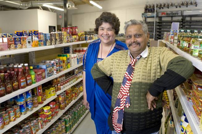 Genie and Suresh "Sam" Goel pose at their convenience store in Henderson Thursday, April 22, 2010. The Goels were involved in a long immigration battle starting in 1998. Sam, originally of India, was deported and Genie fought to bring him back to the U.S. Suresh is now a U.S. citizen. He and Genie are opening a store called American Mini Mart. The store's official opening is May 7. 
