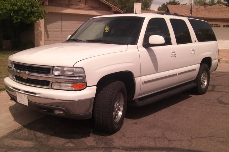White 2002 Chevrolet Suburban LT 1500, with a gray, leather interior bearing both Arizona license plates 379-ZYE and D230S3. This vehicle was one of two used to drive victims around town. 