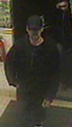 Surveillance video image of the man sought in the robbery. 