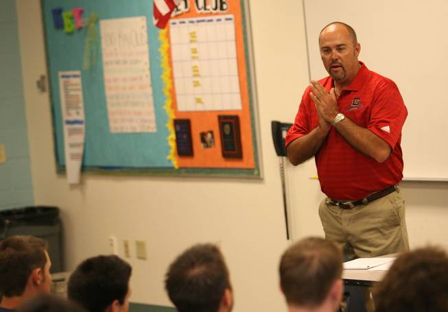 New Coronado football coach Todd Stratton talks with returning players Friday. Stratton, formerly an assistant at Basic, urged the athletes to make a commitment to getting stronger in the weight room.