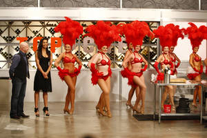 Showgirls line up alongside judges Padma Lakshmi and Tom Colicchio during
the first episode of <em>Top Chef: Las Vegas</em>.