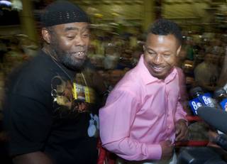 Trainer Naazim Richardson, left, and WBA welterweight champion Shane Mosley talk to reporters as they make an official arrival at the MGM Grand Tuesday, April 27, 2010. Mosley and Floyd Mayweather Jr. will fight in a welterweight bout at the MGM Grand Garden Arena Saturday.
