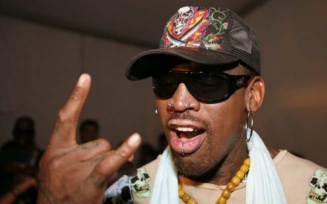 Former NBA basketball player Dennis Rodman poses before the Ed Hardy swimwear runway show in Miami Beach, Fla., on July 19, 2008.