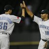 Toronto Blue Jays outfielder Vernon Wells, right, celebrates with reliever Bryan Bullington after they defeated the Chicago White Sox 14-0 in a baseball game, Friday, April 24, 2009 in Chicago.