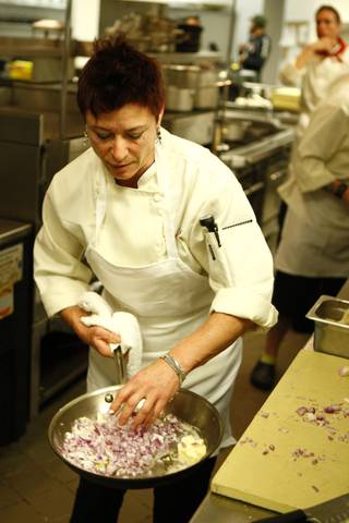 Chef Robin Leventhal cooks up onions during Top Chef sixth season.